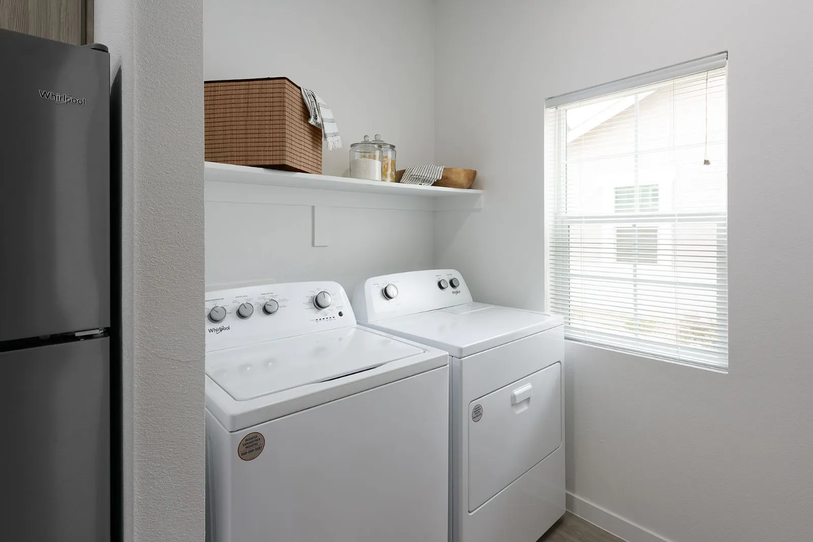 Laundry space with a washer and dryer.