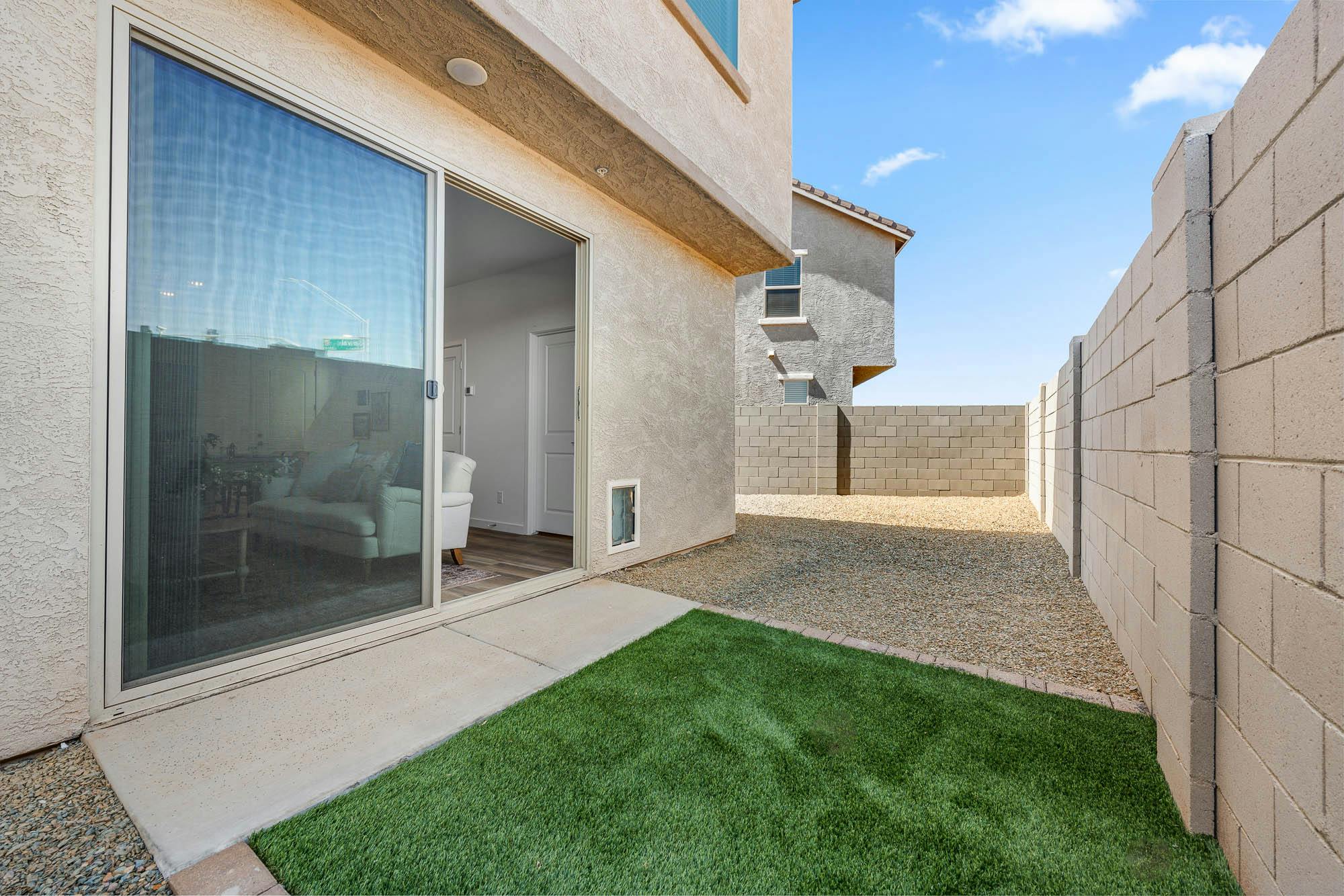 Backyard with Turf and Pet Door