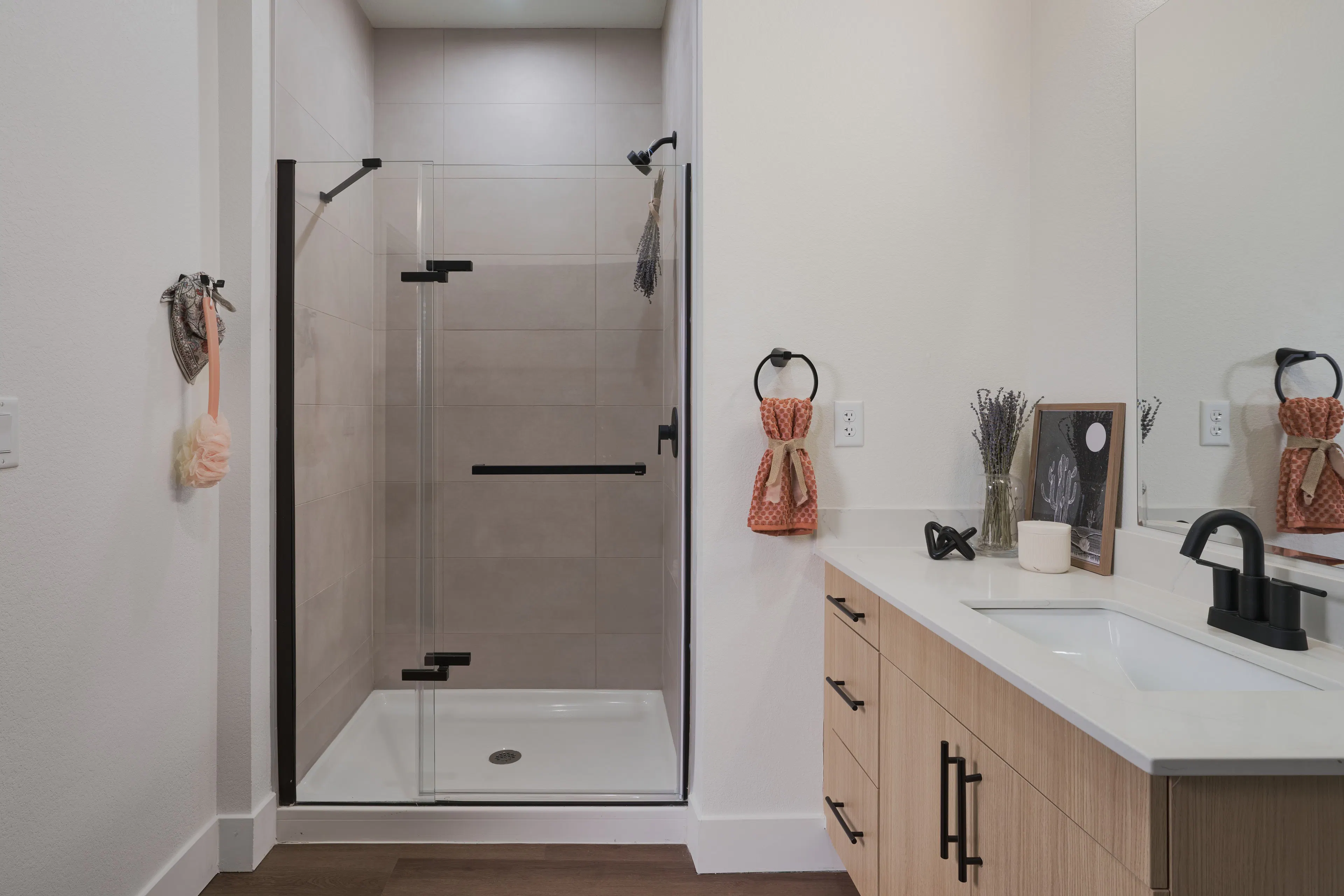 Bathroom with glass shower and updated finishes.
