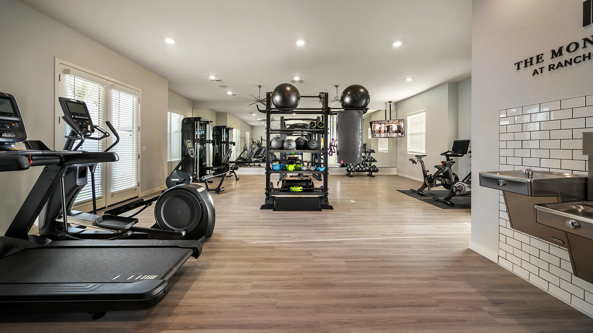 Fitness room with treadmills, exercise bikes and weight equipment.